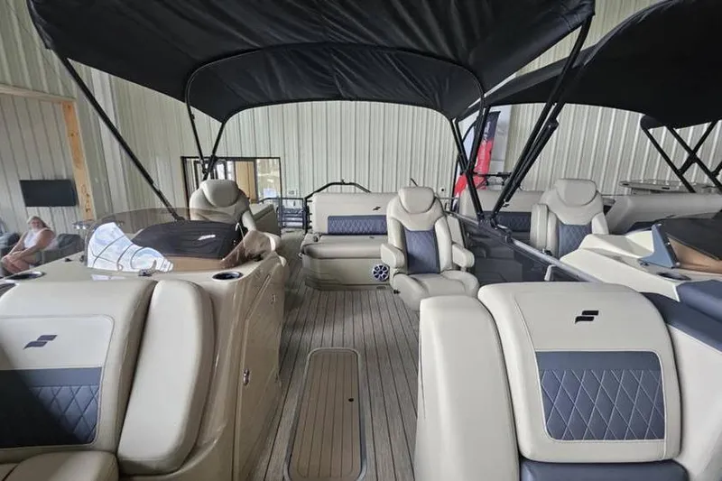 Slide: The Image of 2026 Starcraft CX 23 DL pontoon boat interior with luxurious seating and canopy. - 4