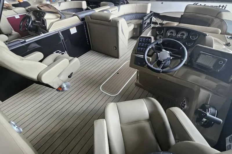 Slide: The Image of 2026 Starcraft CX 23 DL boat interior with modern steering and luxurious seating. - 5
