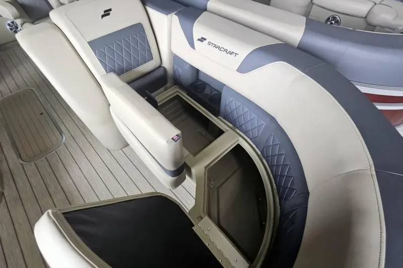 Slide: The Image of 2026 Starcraft CX 23 DL boat interior with luxurious seating and storage compartments. - 6