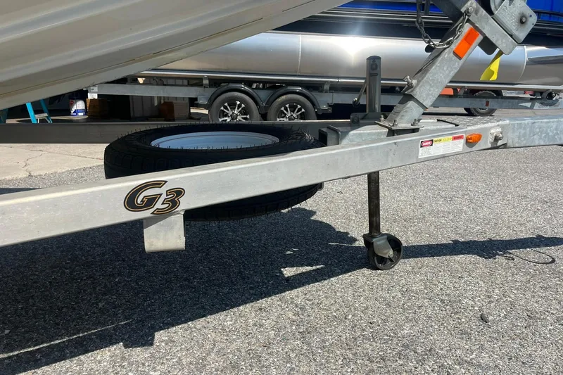 Slide: The Image of 2020 G3 BOATS Sportsman 1810 trailer with spare tire and hitch detail. - 23
