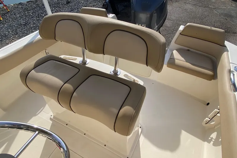 Slide: The Image of 2018 Scout 195 Sportfish dashboard with steering wheel, gauges, and navigation controls. - 12