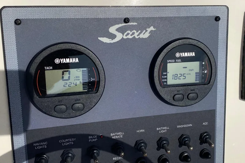 Slide: The Image of 2018 Scout 195 Sportfish boat on trailer at marina, sunny day. - 16