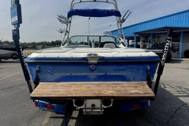 Slide: The Image of 2004 Centurion ELITE V boat, rear view, with "World Championship Towboats" text. - 12