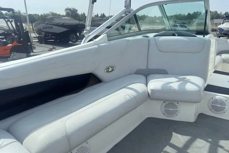 Slide: The Image of 2004 Centurion ELITE V boat interior with white seating and speakers. - 8
