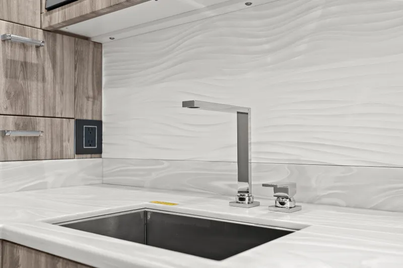 Slide: The Image of 2024 Formula 500 Super Sport Crossover interior with sleek dining area and modern design. - 14