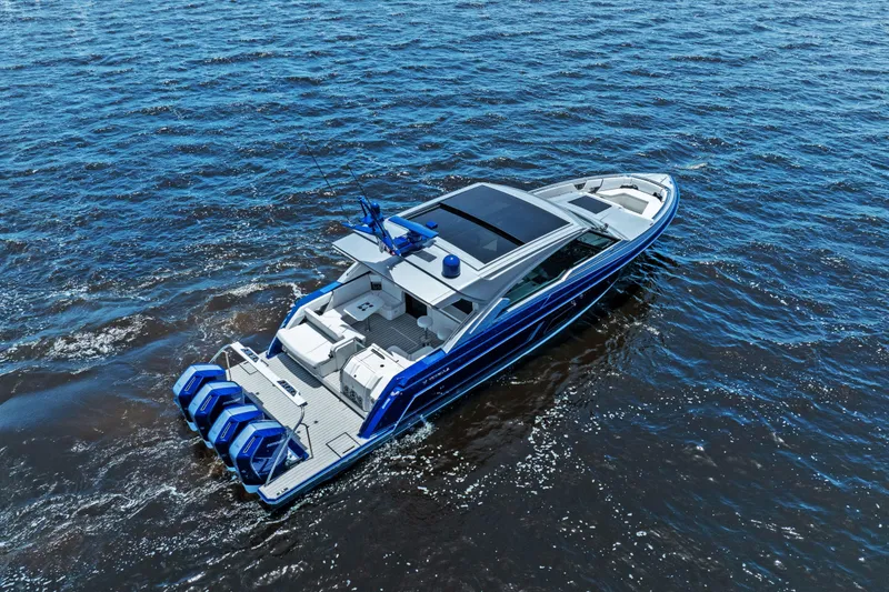 Slide: The Image of 2024 Formula 500 Super Sport Crossover yacht on open water under clear blue sky. - 2