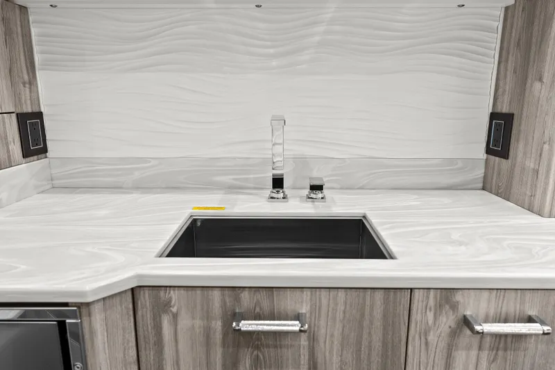 Slide: The Image of 2024 Formula 500 Super Sport Crossover interior with modern seating and table. - 23