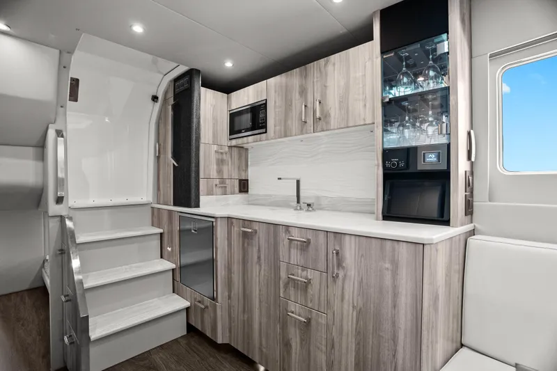 Slide: The Image of Modern kitchen sink in 2024 Formula 500 Super Sport Crossover with sleek design and wood accents. - 24