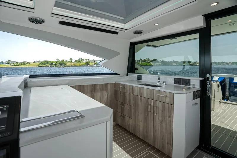 Slide: The Image of 2024 Formula 500 Super Sport Crossover anchor compartment open on water. - 26