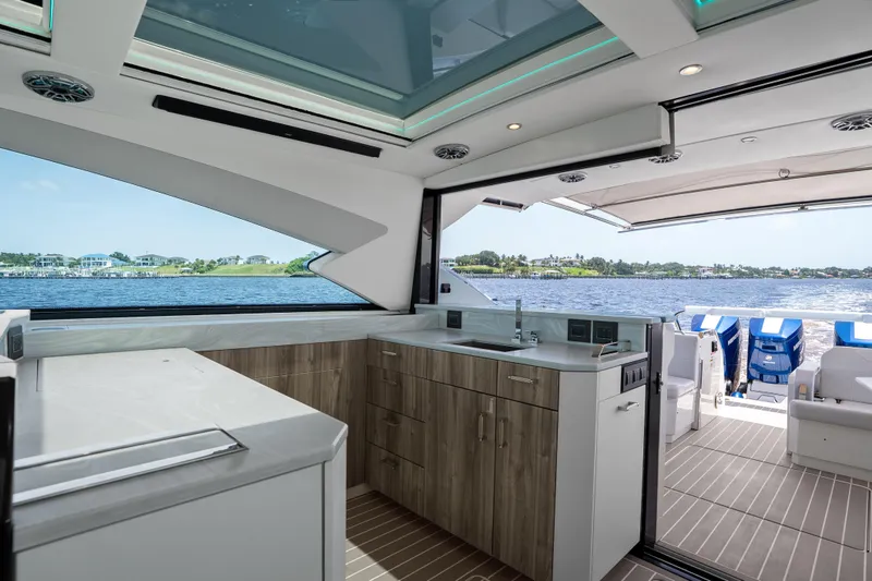 Slide: The Image of Luxurious interior of 2024 Formula 500 Super Sport Crossover yacht with modern kitchen amenities. - 27
