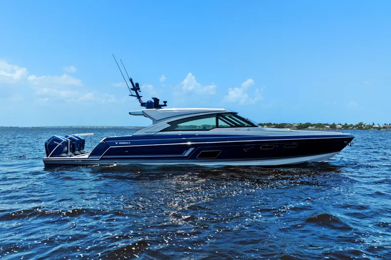 Slide: The Image of 2024 Formula 500 Super Sport Crossover boat cruising on open water, showcasing sleek design. - 3