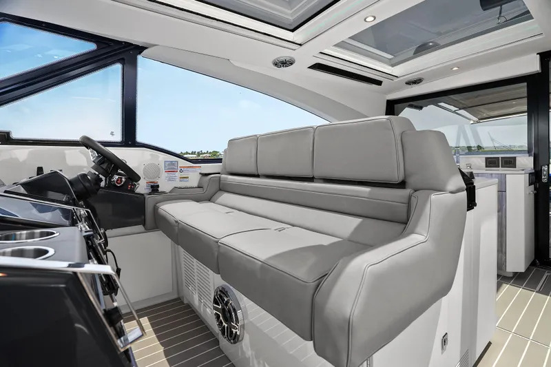 Slide: The Image of 2024 Formula 500 Super Sport Crossover helm with advanced navigation displays and controls. - 30