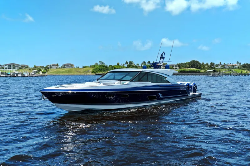 Slide: The Image of 2024 Formula 500 Super Sport Crossover yacht on open water under clear blue sky. - 4