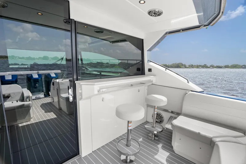 Slide: The Image of 2024 Formula 500 Super Sport Crossover luxury yacht with spacious white seating area. - 45