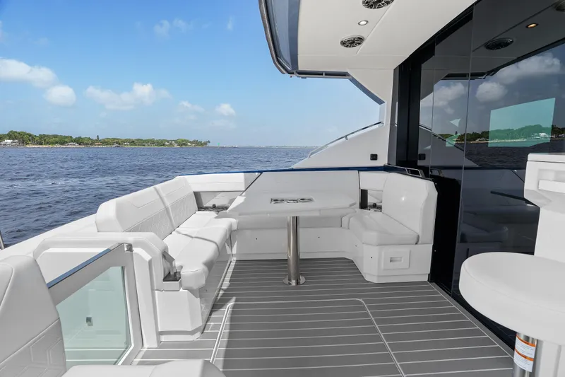 Slide: The Image of 2024 Formula 500 Super Sport Crossover yacht interior with sleek seating and water view. - 46