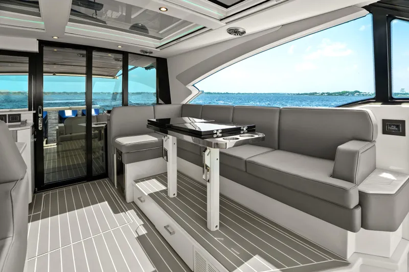 Slide: The Image of Interior view of 2024 Formula 500 Super Sport Crossover, showcasing sleek window design and ocean scenery. - 51