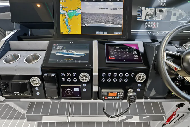 Slide: The Image of 2024 Formula 500 Super Sport Crossover dashboard with advanced navigation displays on open water. - 53