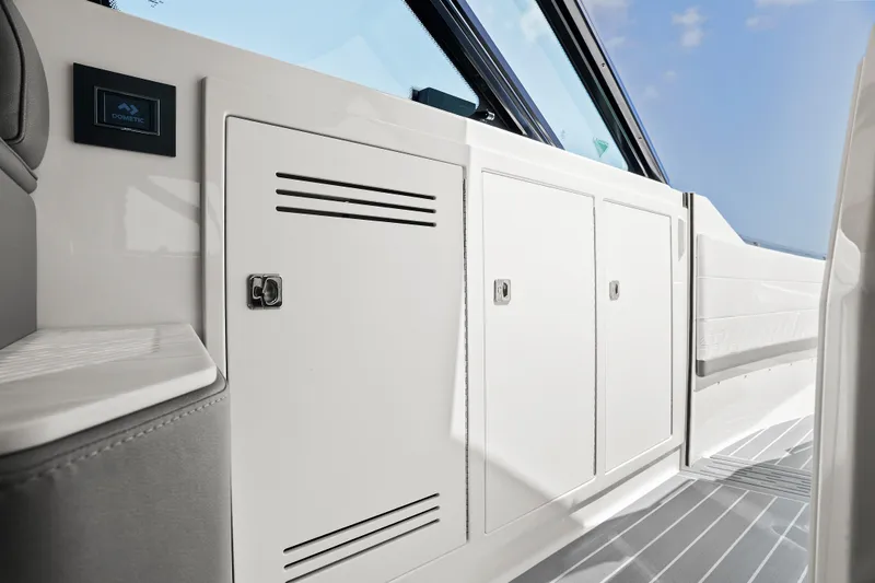 Slide: The Image of 2024 Formula 500 Super Sport Crossover boat interior with luxurious seating and twin engines. - 69