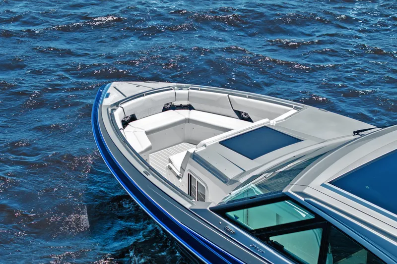 Slide: The Image of 2024 Formula 500 Super Sport Crossover yacht on open water, featuring radar and flags. - 7