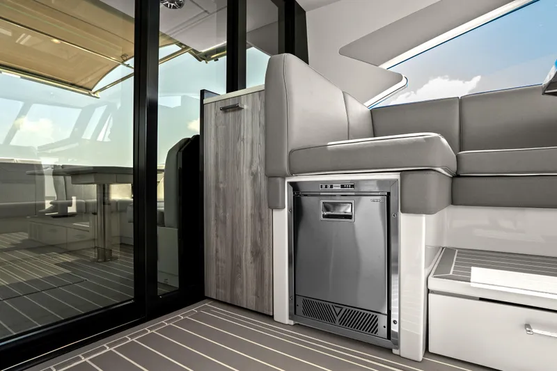 Slide: The Image of 2024 Formula 500 Super Sport Crossover interior with modern kitchen and scenic water view. - 76