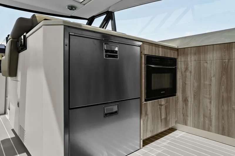 Slide: The Image of 2024 Formula 500 Super Sport Crossover boat on blue water, showcasing sleek design. - 8