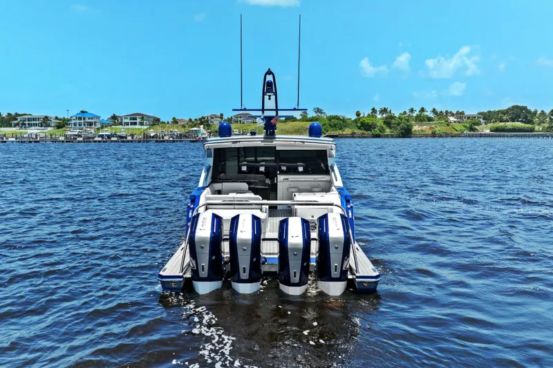 Slide: The Image of 2024 Formula 500 Super Sport Crossover boat on water, showcasing powerful engines and sleek design. - 87