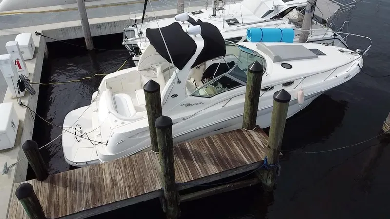 Slide: The Image of 2005 Sea Ray 320 Sundancer docked at marina. - 2