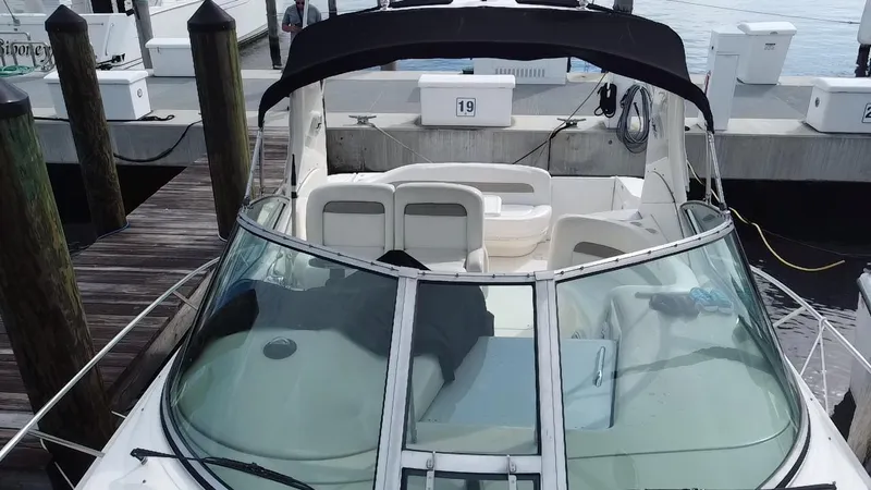 Slide: The Image of 2005 Sea Ray 320 Sundancer docked at a marina. - 6