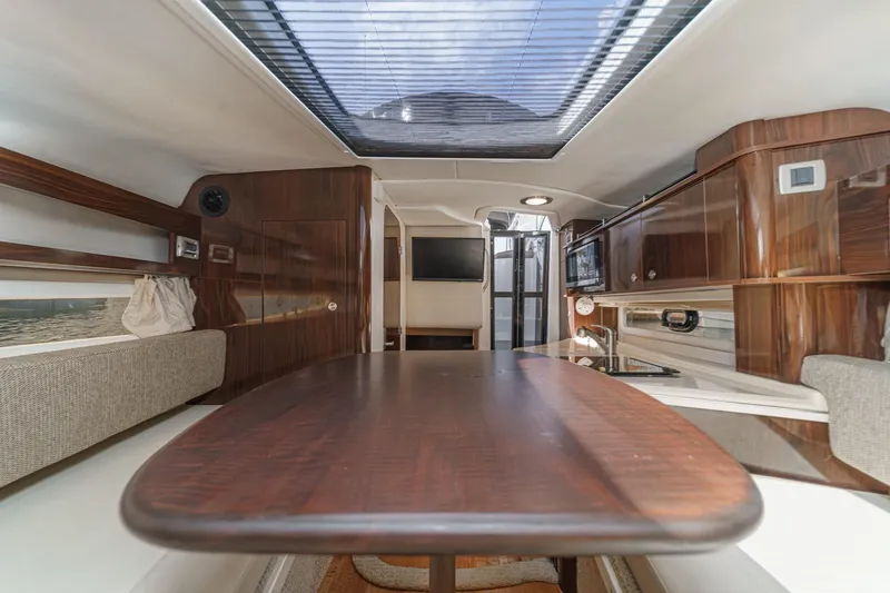 Slide: The Image of Interior of 2016 Sea Ray 280 Sundancer yacht with elegant wood finish and skylight. - 24