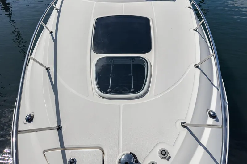 Slide: The Image of 2016 Sea Ray 280 Sundancer boat deck with hatch, stainless steel railings, and sleek design. - 9