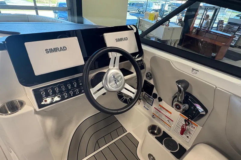 Slide: The Image of 2025 Sea Ray SDX 270 Surf boat dashboard with Simrad displays and controls. - 11