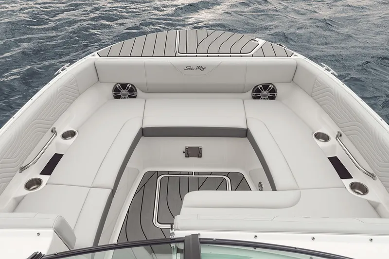 Slide: The Image of 2025 Sea Ray SDX 270 Surf boat interior with open engine compartment in showroom. - 4