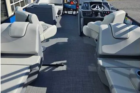 Slide: The Image of 2025 Starcraft GX 22 R DH Sport boat interior with modern seating and steering console. - 3