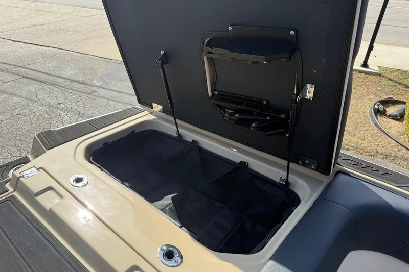 Slide: The Image of Open storage compartment in 2026 Moomba Mojo boat, showcasing spacious interior design. - 12