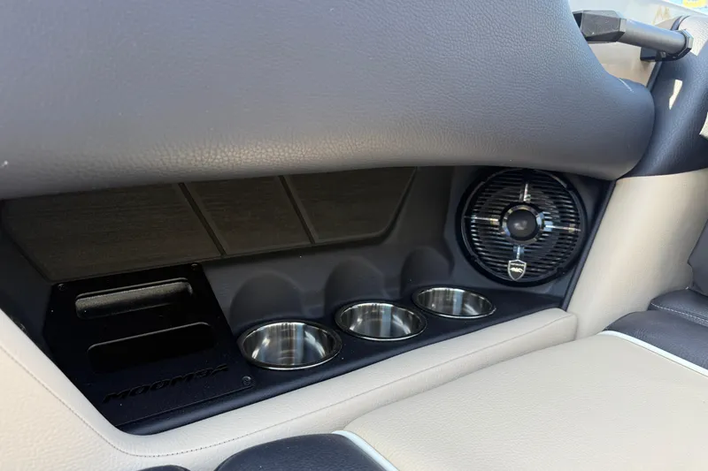 Slide: The Image of 2026 Moomba Mojo interior with cup holders and speaker detail. - 17