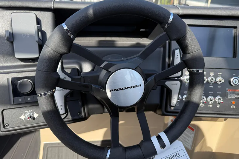 Slide: The Image of 2026 Moomba Mojo steering wheel and dashboard controls. - 23