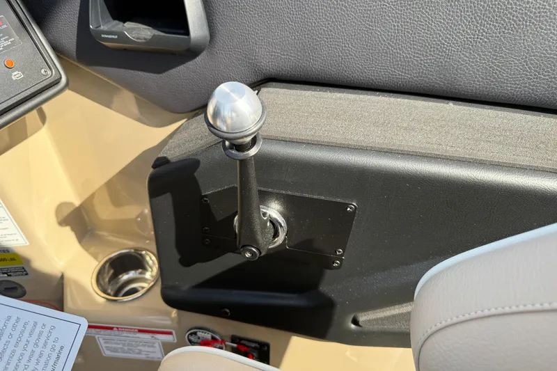 Slide: The Image of Interior of 2026 Moomba Mojo boat showing control lever and cup holder. - 27