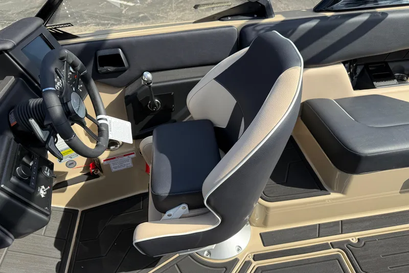 Slide: The Image of 2026 Moomba Mojo boat interior with steering wheel and seating. - 28