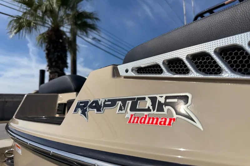 Slide: The Image of 2026 Moomba Mojo boat with Raptor Indmar engine branding, palm tree in background. - 41