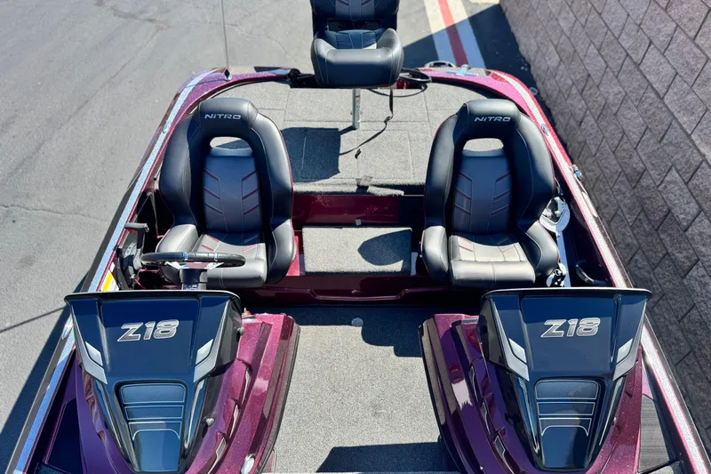 Slide: The Image of 2023 Nitro Z18 boat interior with dual seats and steering console. - 12