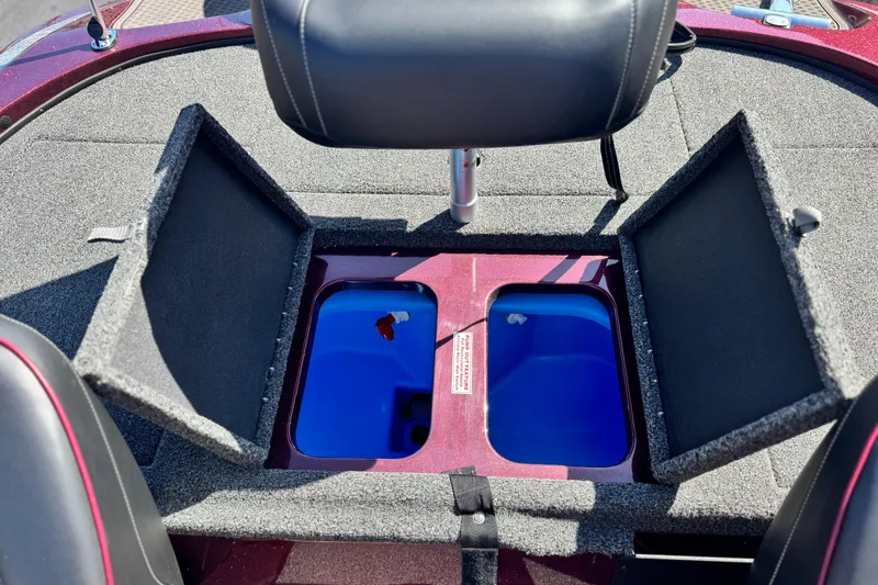 Slide: The Image of 2023 Nitro Z18 boat interior with open storage compartments and seating. - 13