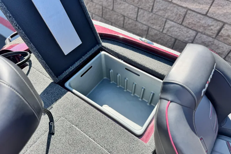 Slide: The Image of Open storage compartment in 2023 Nitro Z18 boat, featuring cushioned seats and durable design. - 14