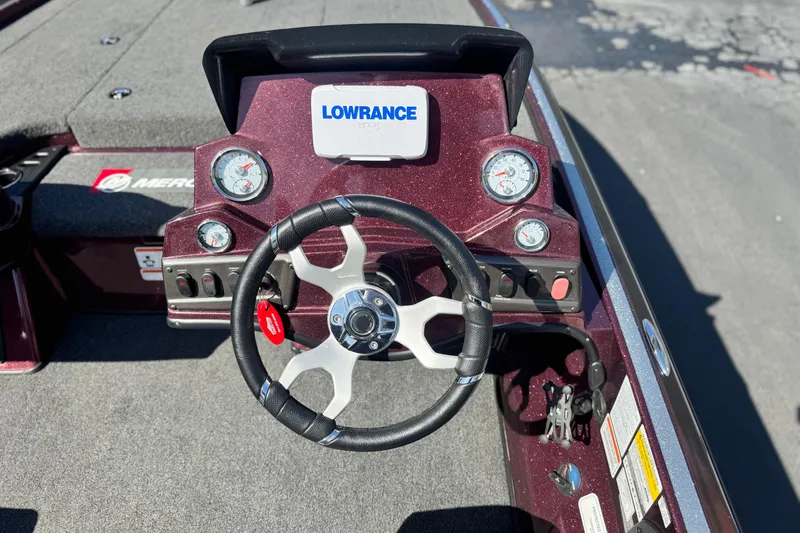 Slide: The Image of Steering console of 2023 Nitro Z18 boat with Lowrance display and gauges. - 18