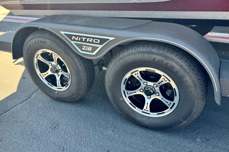 Slide: The Image of 2023 Nitro Z18 trailer with Load Star tires and stylish alloy wheels. - 19