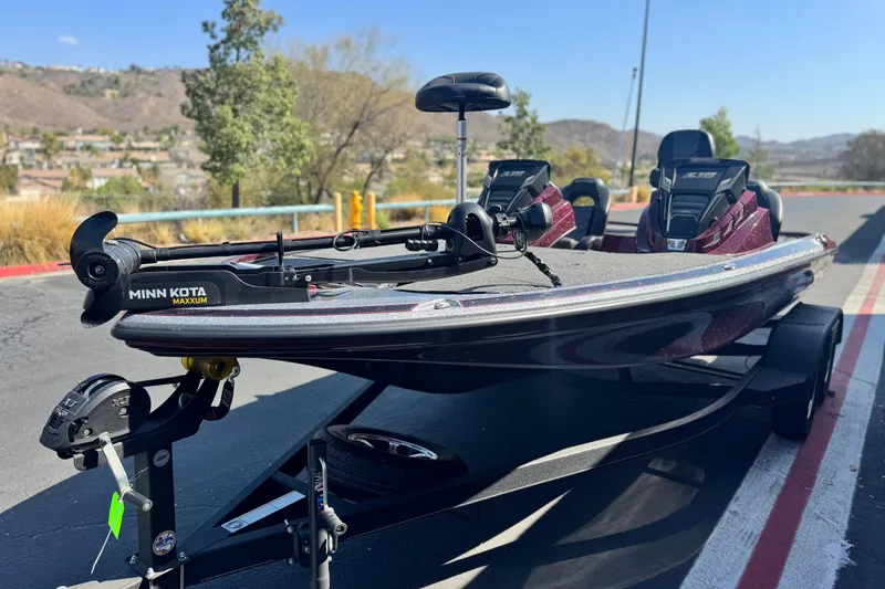 Slide: The Image of 2023 Nitro Z18 boat with Minn Kota Maxxum motor on trailer, outdoor setting. - 3