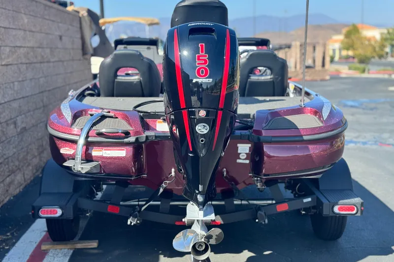 Slide: The Image of 2023 Nitro Z18 boat with Mercury 150 engine, parked outdoors. - 4