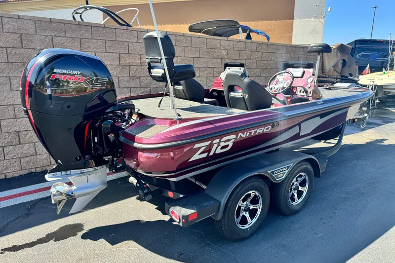 Slide: The Image of 2023 Nitro Z18 boat with Mercury Pro XS engine, parked on a trailer. - 5