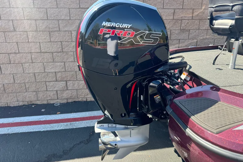 Slide: The Image of 2023 Nitro Z18 boat with Mercury Pro XS 150 outboard motor, parked on pavement. - 6