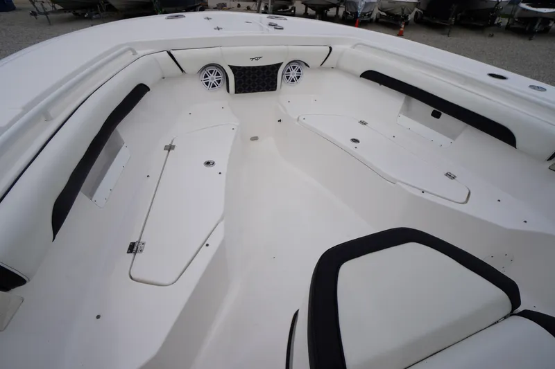 Slide: The Image of 2021 Tidewater 256 CC Adventure boat interior with spacious seating and storage compartments. - 12