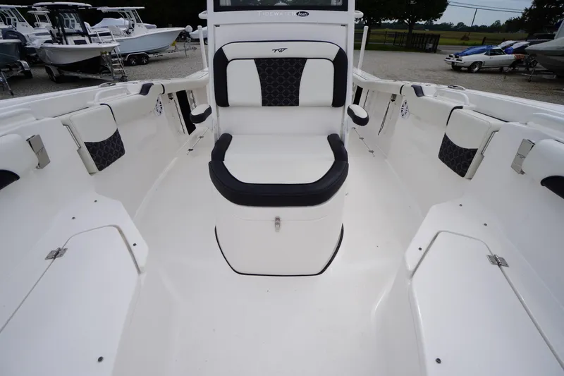Slide: The Image of 2021 Tidewater 256 CC Adventure boat interior with seating and storage compartments. - 24